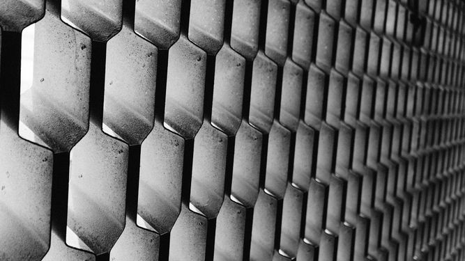 Black and white close-up of geometric wall pattern