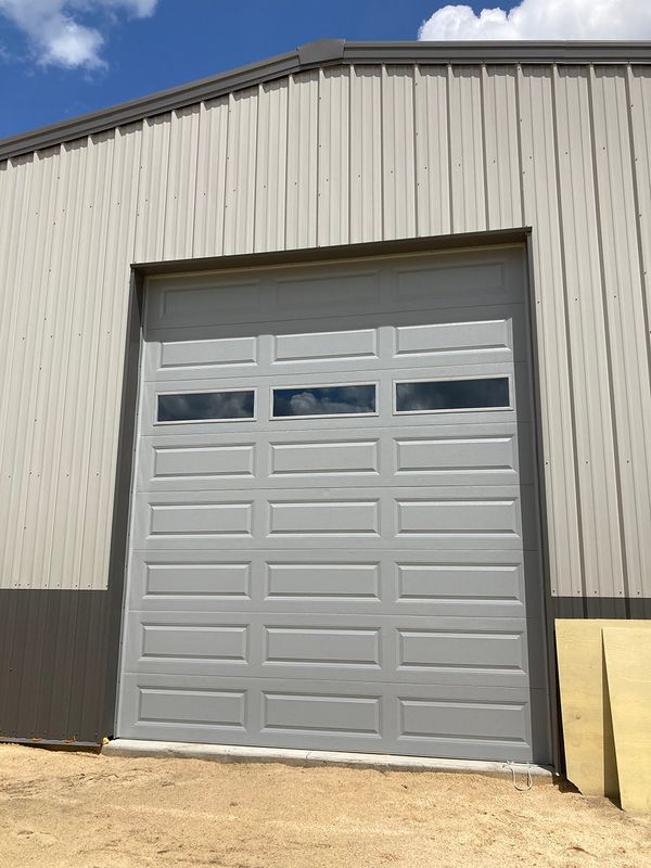 Steel building with tall garage door