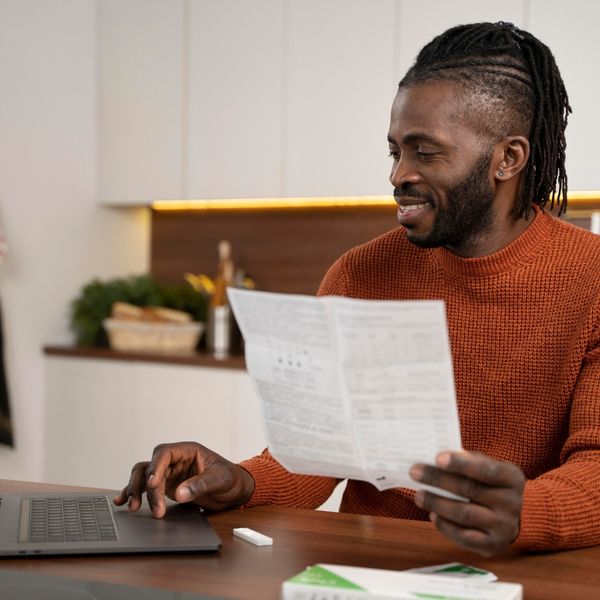 image of a man looking at an energy bill