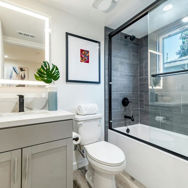 bathroom with a tub and shower all in one 