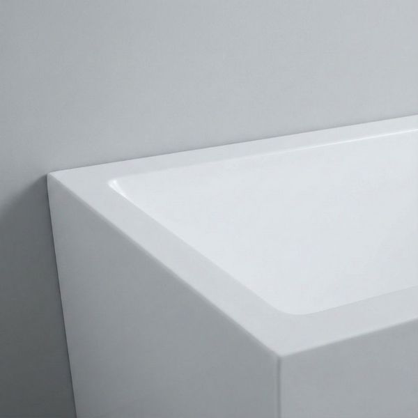Sleek corner design of a minimalist white bathtub