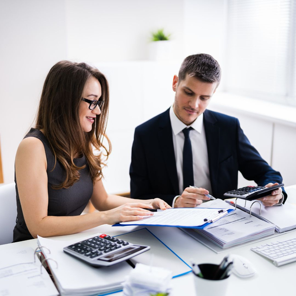 business owners looking at loan terms