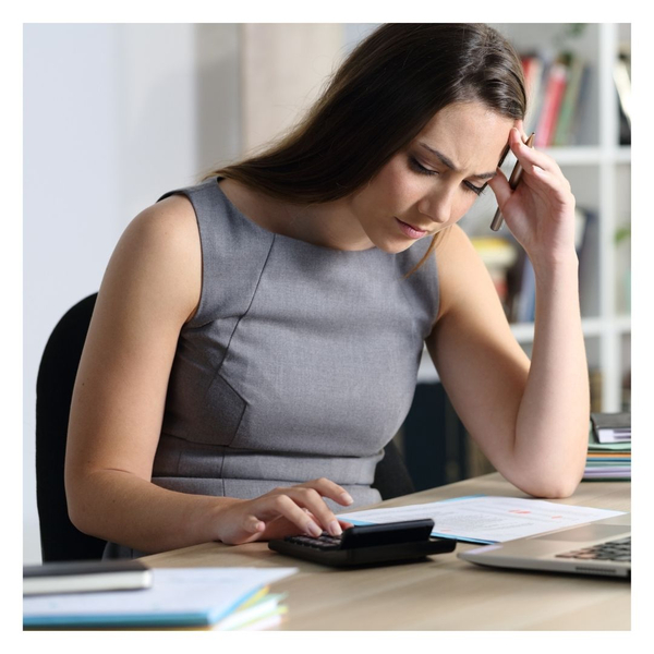 business woman evaluating debt