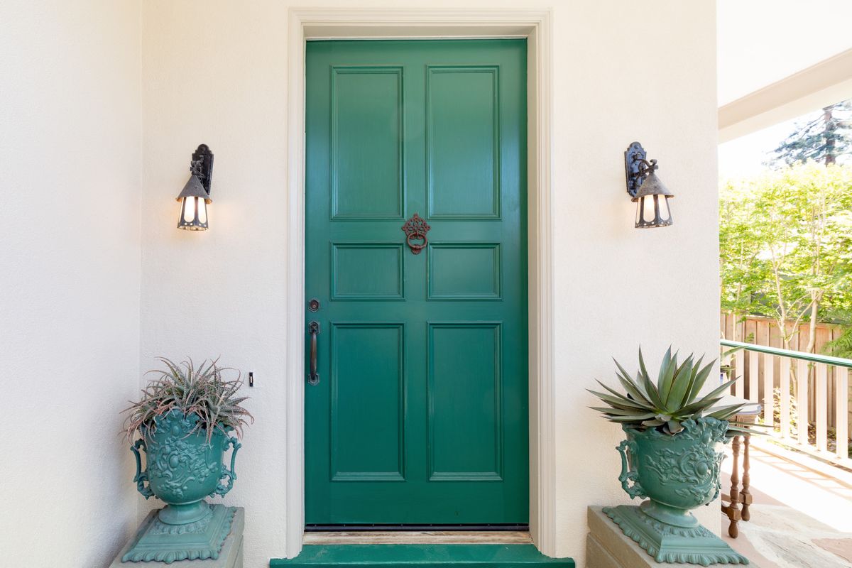 Green-entry-door-with-door-kno.jpg