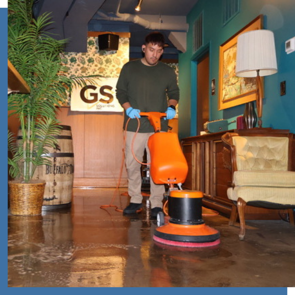 man professionally cleaning floor