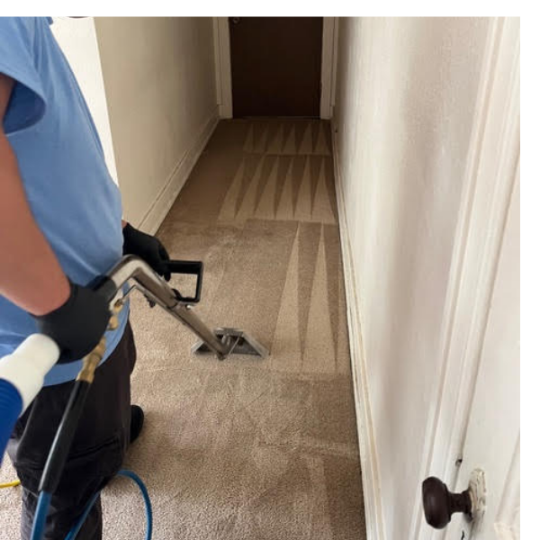 Image of a worker vacumming