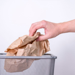 person throwing trash away