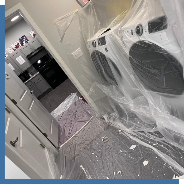 Washer and dryer covered along with floor with protective sealing