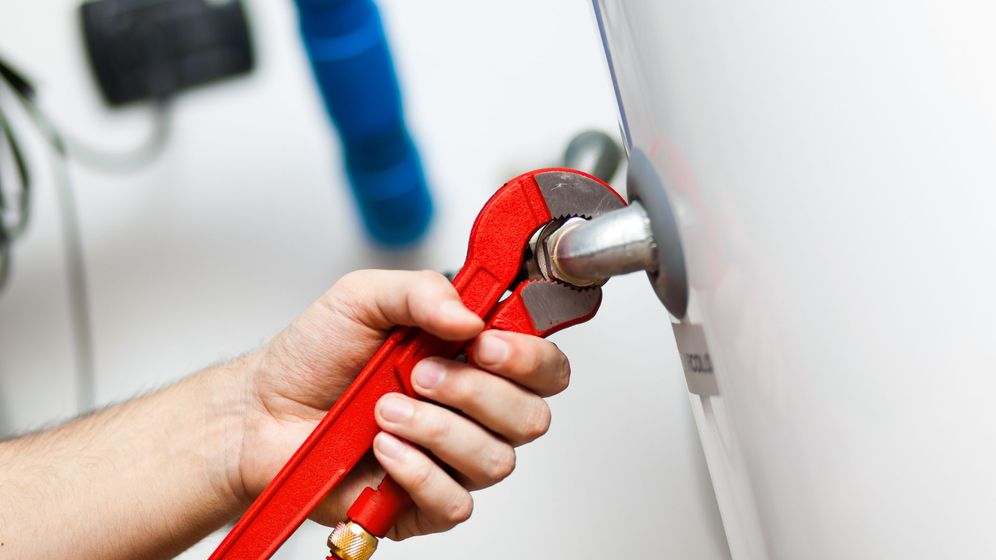 wrench repairing water heater