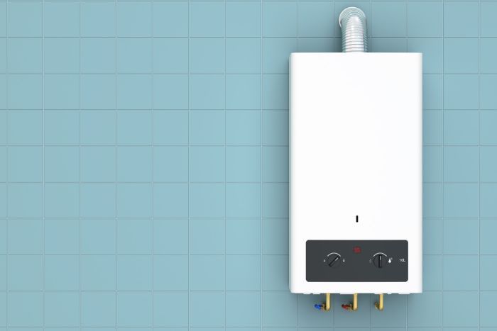 a tankless water heater on a blue wall