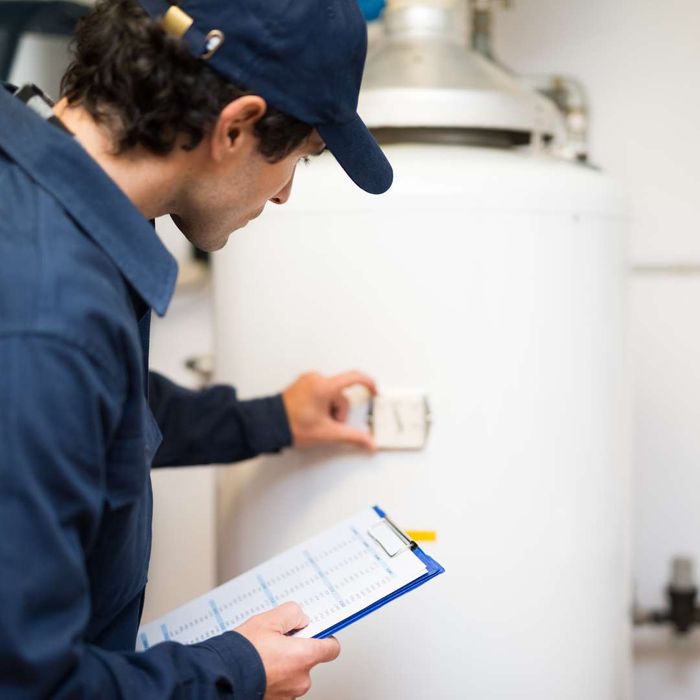 technician working with water heater