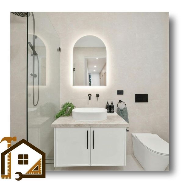 lighted mirror in guest bathroom