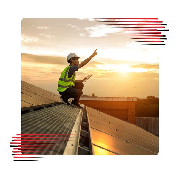 Roofer working on a metal roof