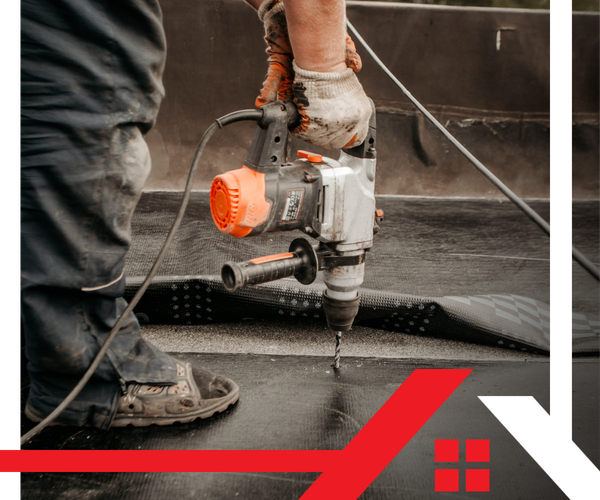 crew member working on a commercial roof