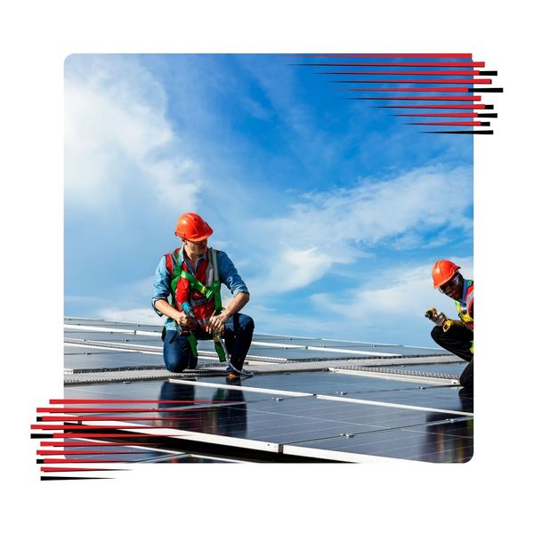 Roofers working on a solar roof