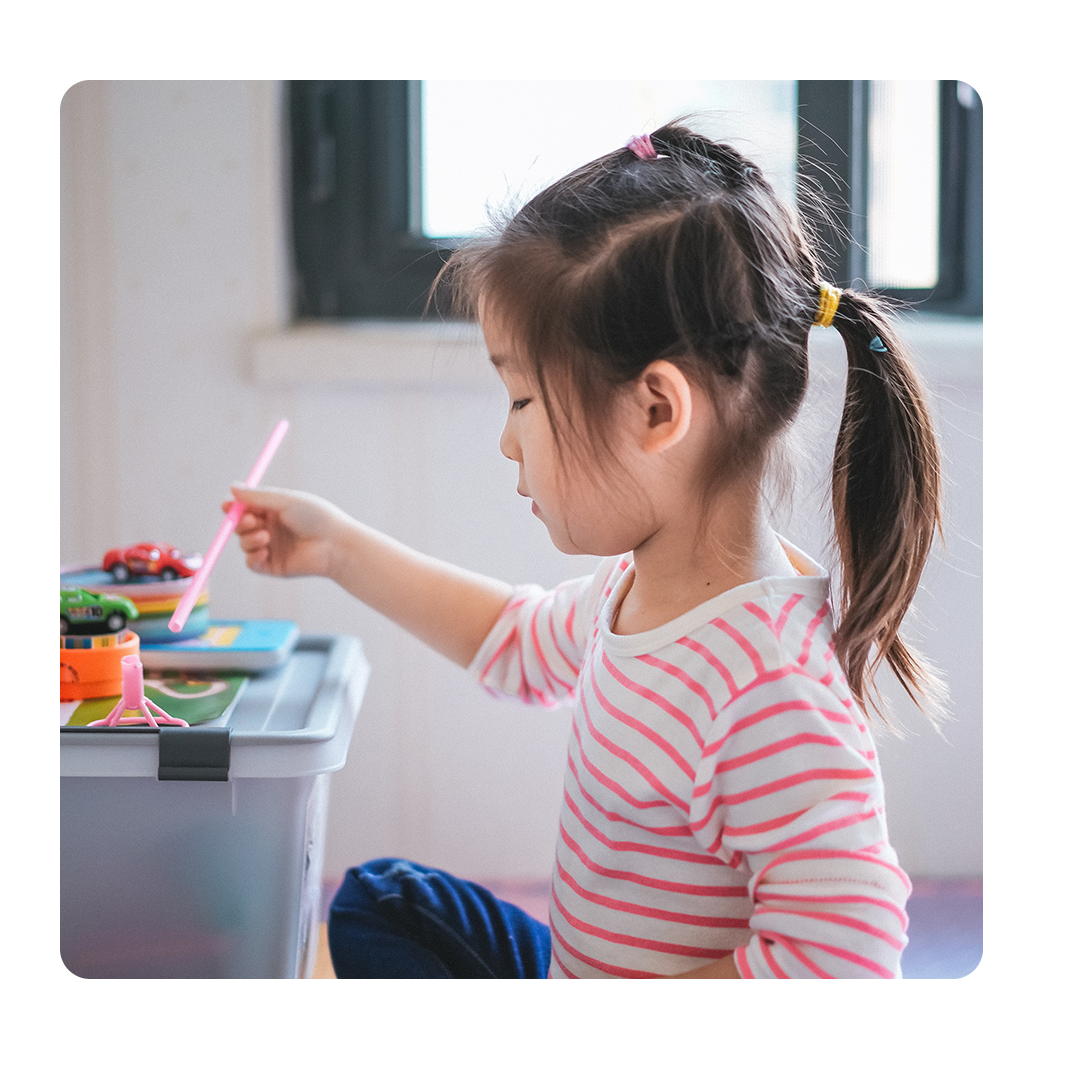 Young girl playing with toys