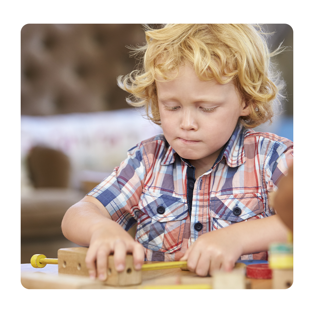 Children working with building tools at Montessori school