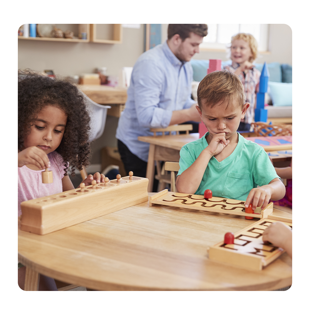 Children working on puzzles at Montessori school