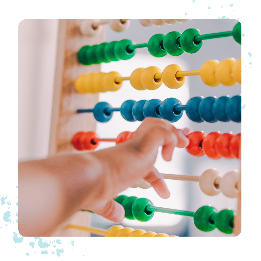 child hand with abacus 