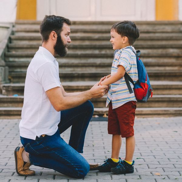 father dropping off child at school