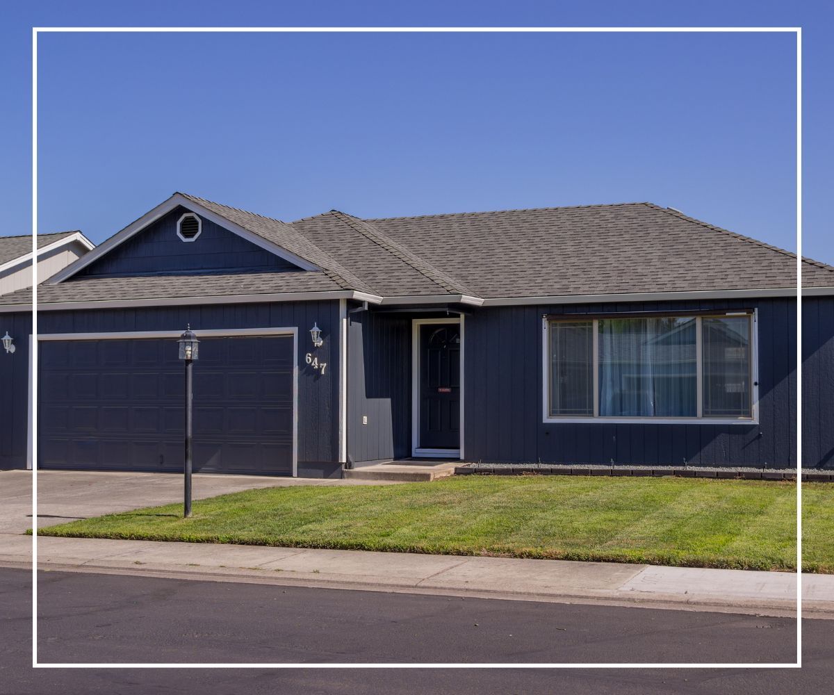 A ranch level home with a nice looking asphalt roof