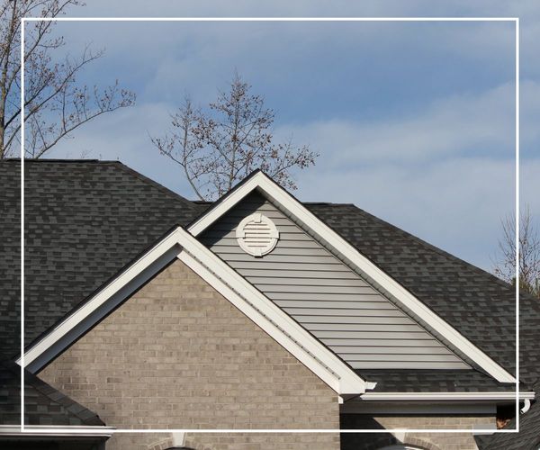 A newly installed roof on top of a suburban home