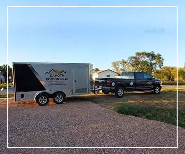 Image of Dakota Roofing truck and trailer