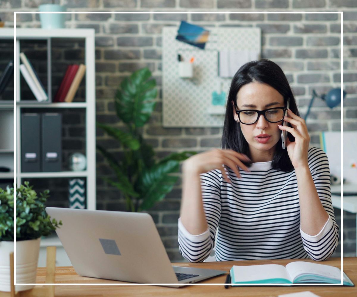 A woman on a phone call with her insurance