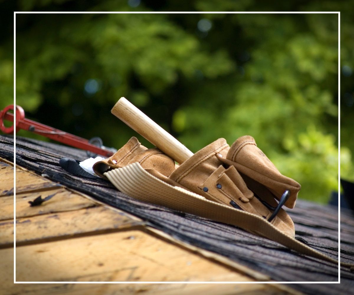 A toolbelt sitting on top of a roof
