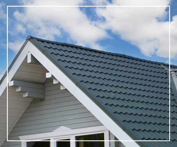 The top of a nice home with a new roof and siding