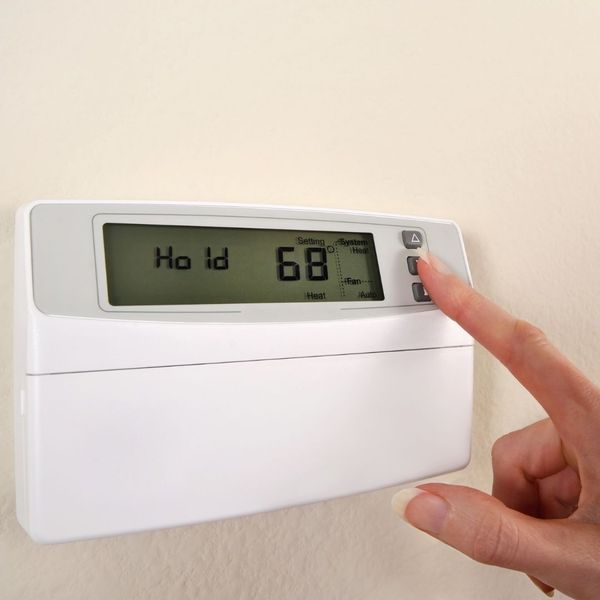 adjusting a thermostat