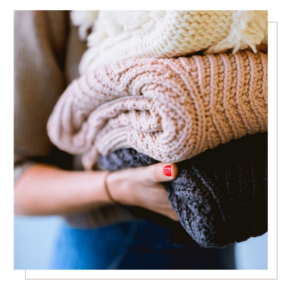 Person with folded laundry