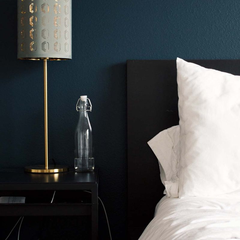 guest bed and bedside lamp