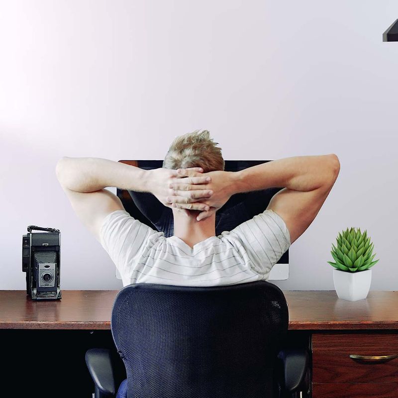 man sitting at desk in home office man sitting at desk in home office