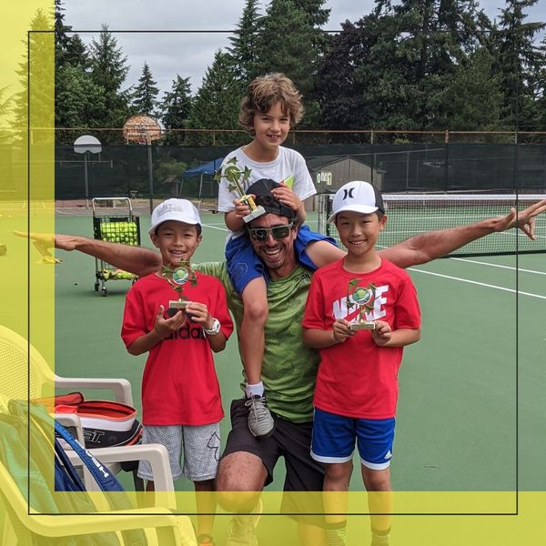 Group of tennis players with a trophy