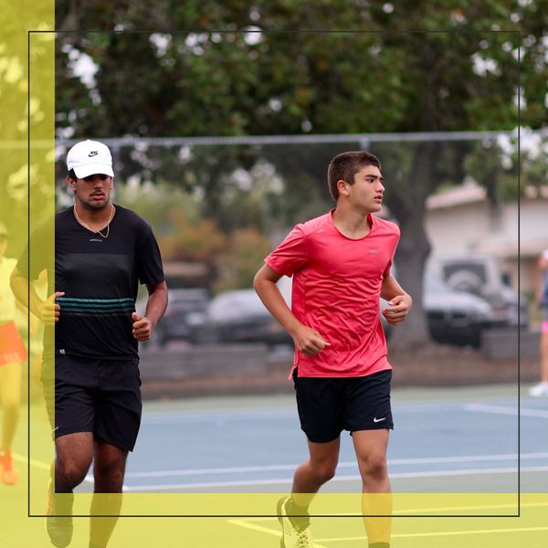 men jogging on tennis court