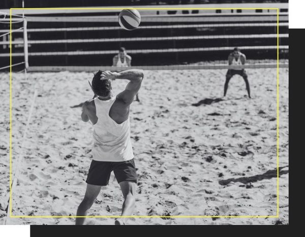 group playing beach volleyball (black and white)