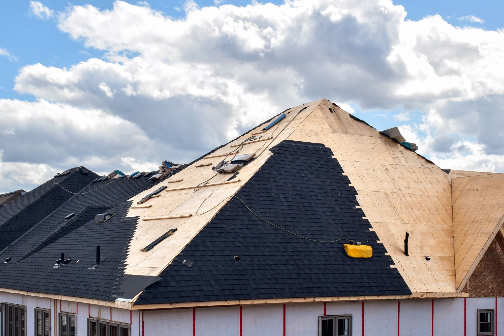 imgi_31_the-process-of-installation-of-black-roof-shingles-on-new-residential-home.jpg