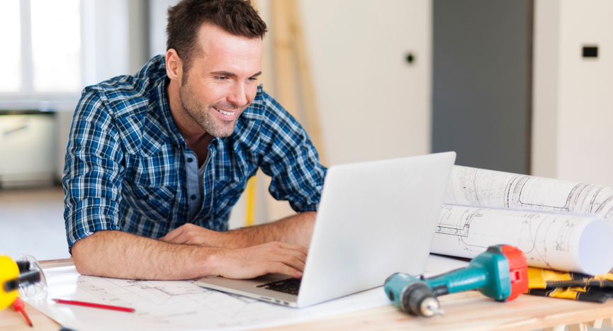 image of a man designing on a laptop
