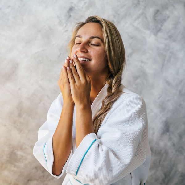Smiling woman in a spa robe