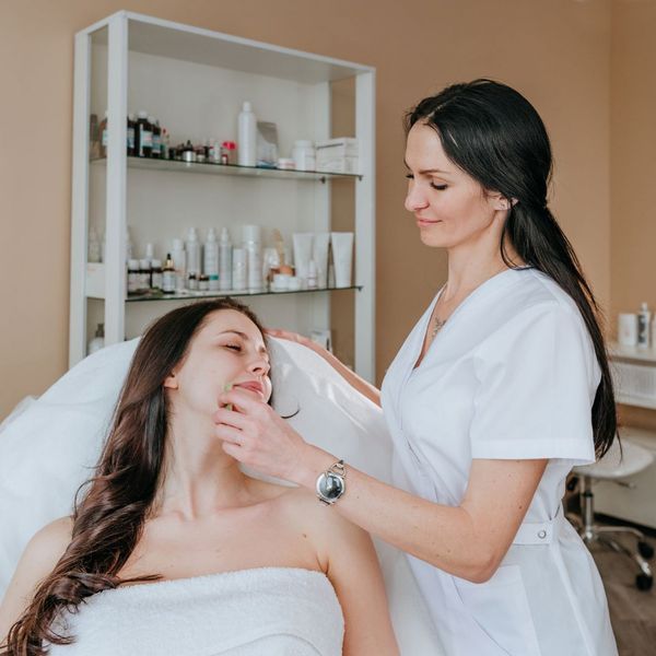 Esthetician with a client