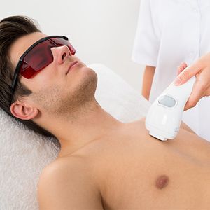 man getting laser hair removal on chest