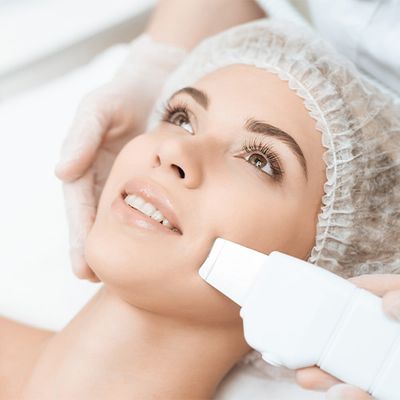 An image of a woman undergoing a laser facial treatment