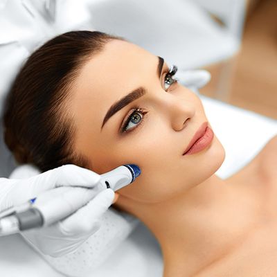 woman receiving facial skin treatment