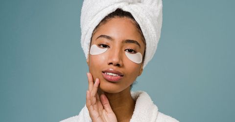Woman wearing under eye gel patches
