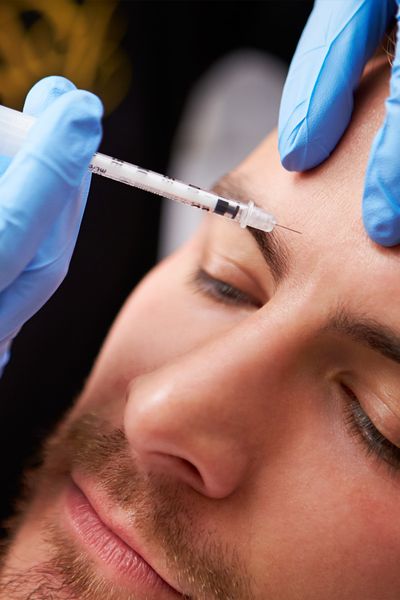 a man getting forehead injections of Botox