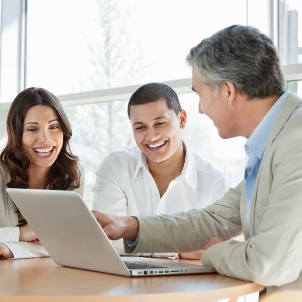 people looking at a laptop together