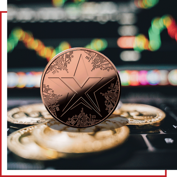 A single TEXIT coin balanced on a stack of gold currency with stock charts in the background.