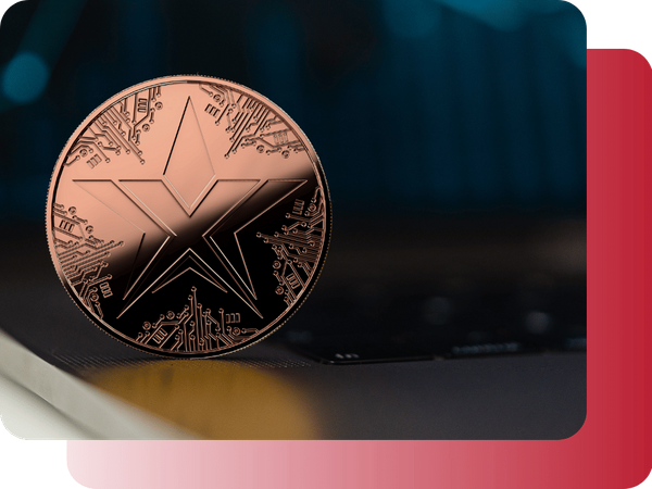 A copper TEXITcoin standing on the edge of a laptop keyboard with a dark, blurred background.