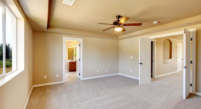 remodeled room with ceiling fan
